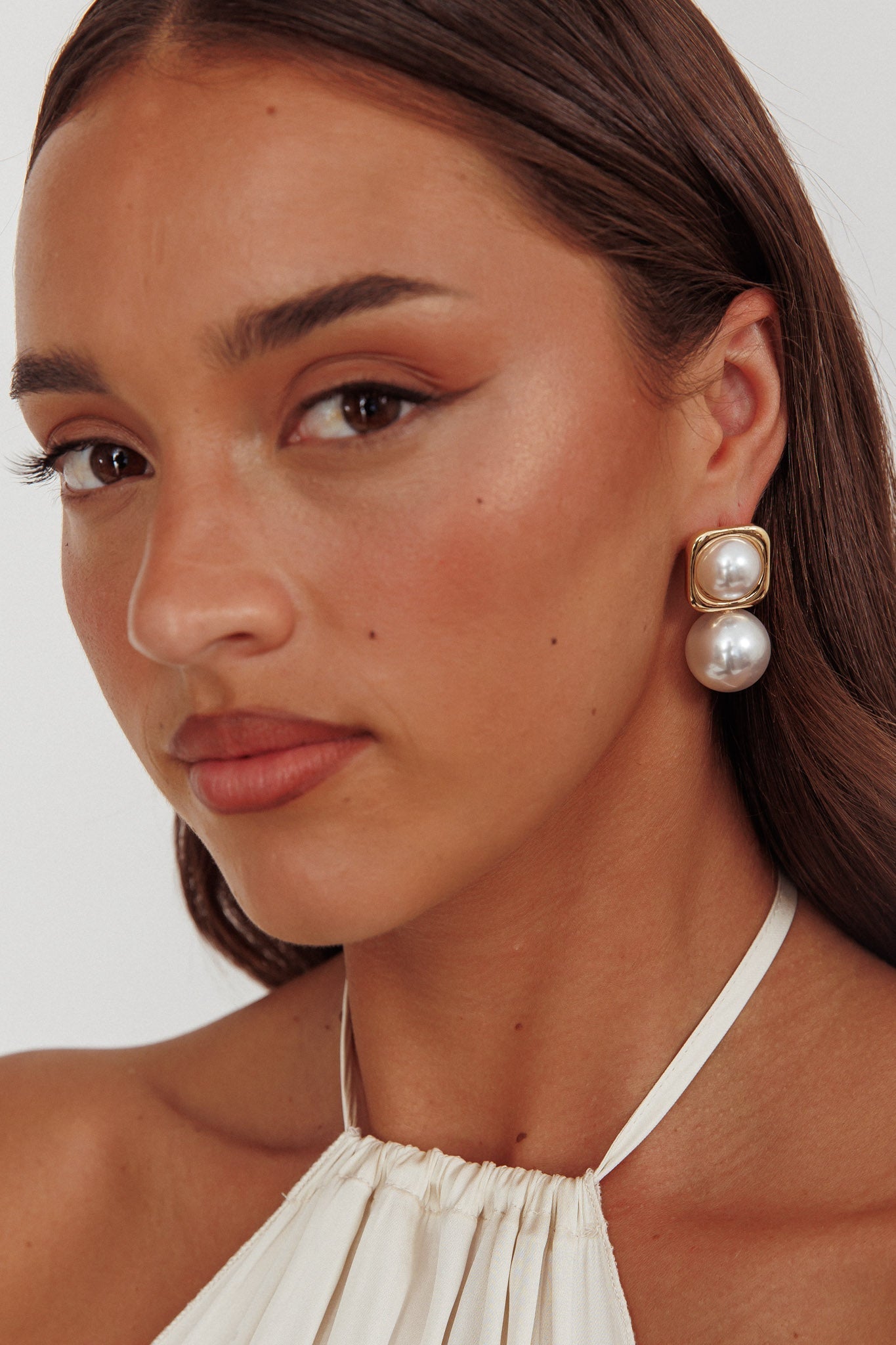 Boucles d'oreilles Clara en perles carrées dorées
