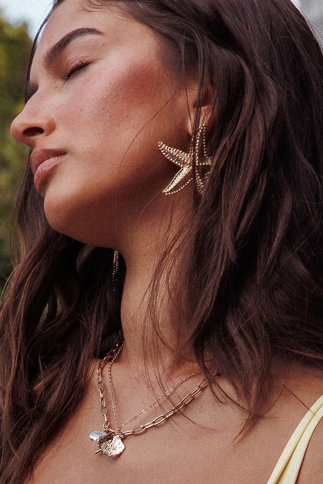 Boucles d'oreilles pendantes Delphin étoile de mer en or